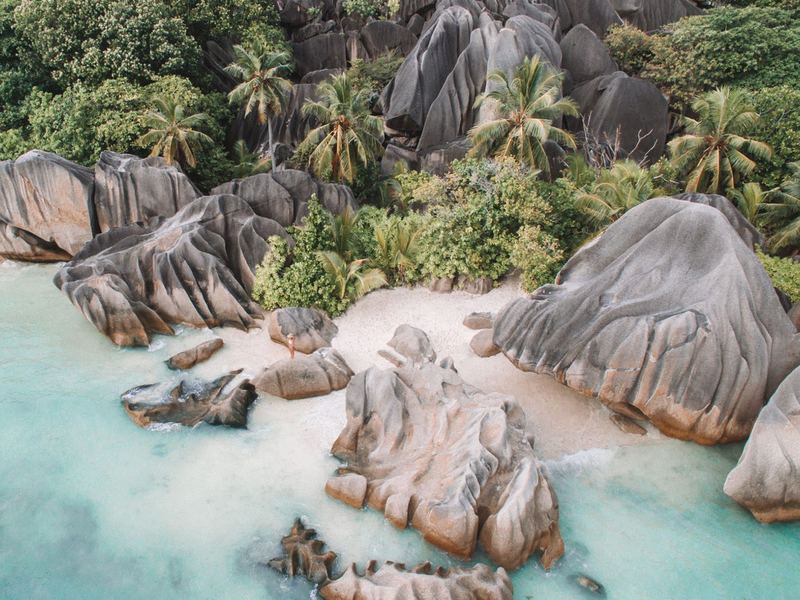 Anse Source d'Argent on La Digue with pink granite boulders and shallow turquoise water