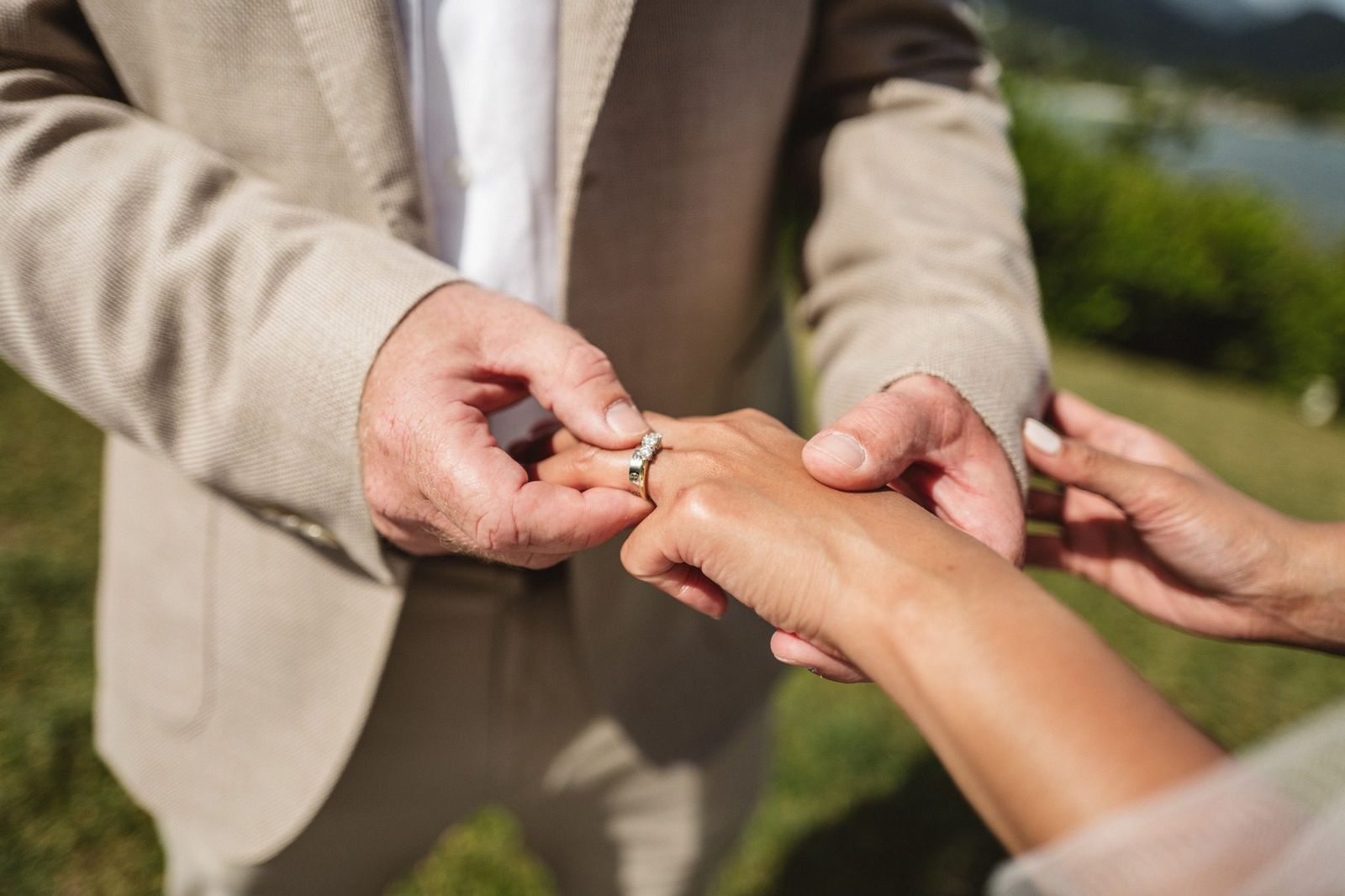 A registrar conducting a legal ceremony under a pavilion on the beach