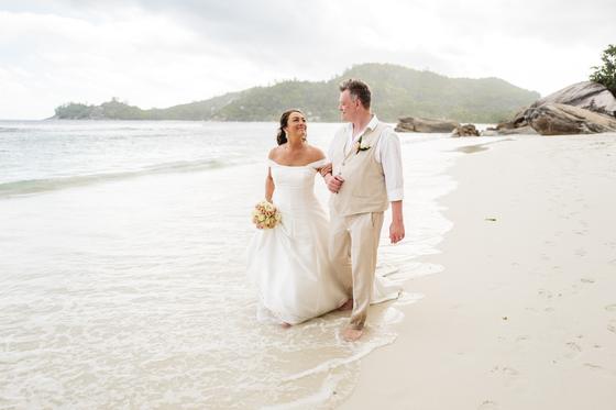 Walking the surf line, bouquet in hand