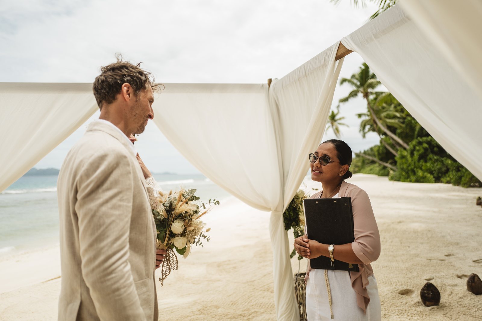A barefoot beach ceremony with the celebrant at Six Senses, Felicite Island