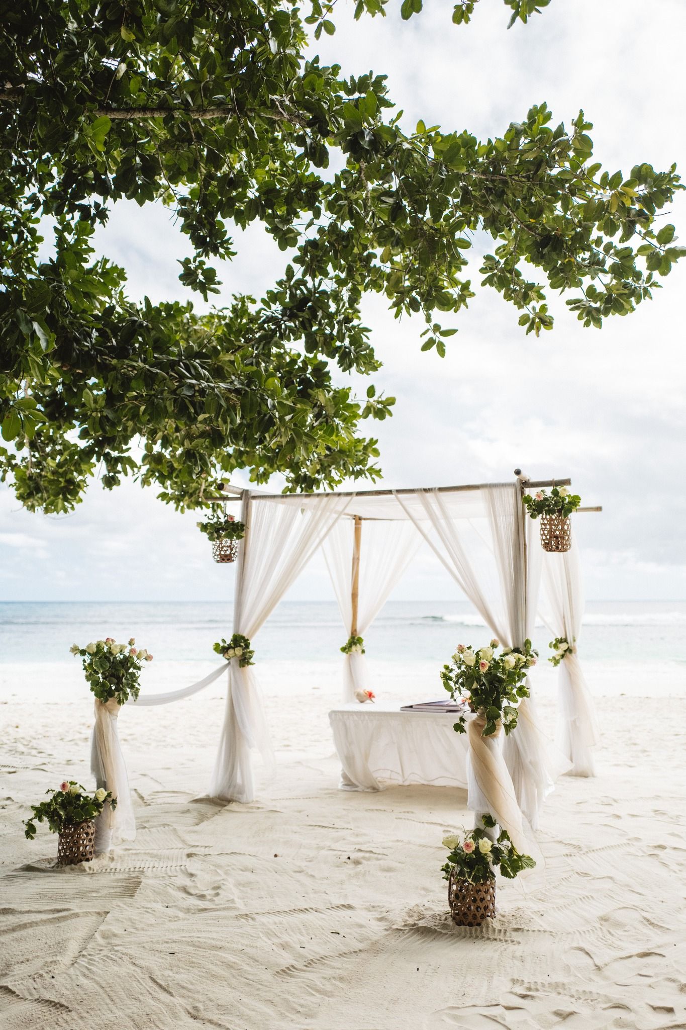 Wedding couple photographed on a Seychelles beach