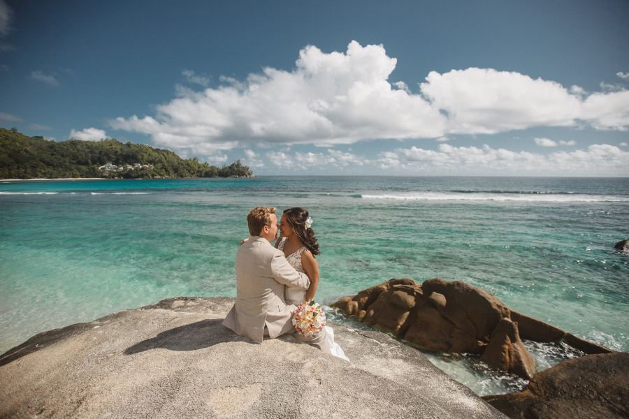 Couple at golden hour after their Seychelles beach wedding